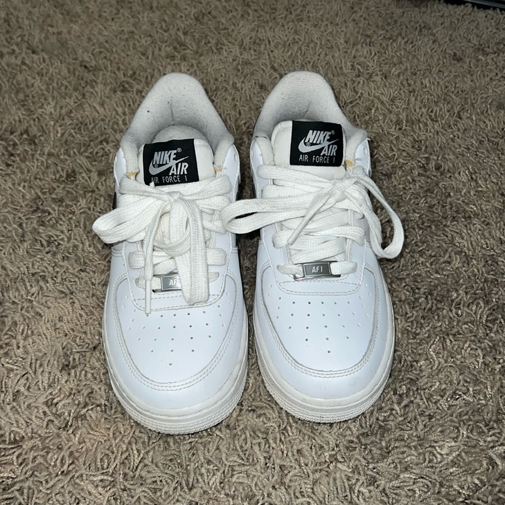 WHITE NIKE AIR FORCES WITH BLACK NIKE SWOOSH